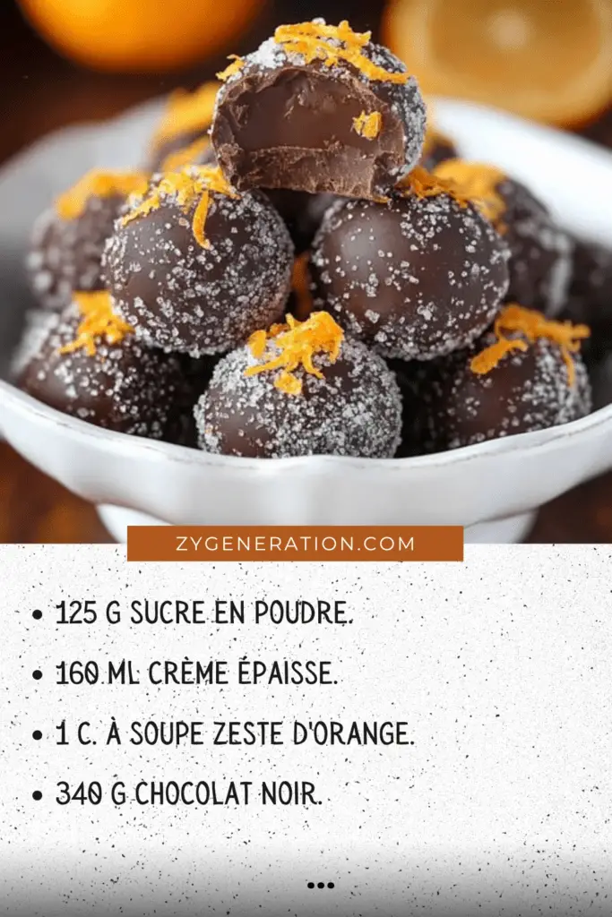 Truffes au chocolat roulées dans du sucre, décorées de zestes d’orange, et présentées sur un plateau festif.