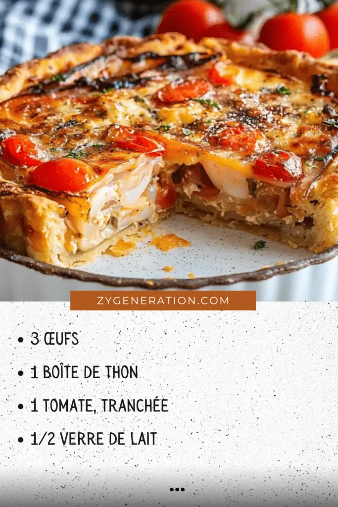 Quiche thon-tomate dorée et savoureuse, garnie de tranches de tomate fraîches et de morceaux de chèvre, servie dans une assiette avec une salade verte.