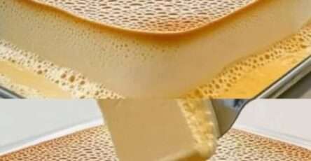 Tranche de flan maison moelleux, doré et lisse, servie sur une assiette avec cuillère