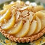 Tarte poires amandes gourmande dorée et décorée d’amandes effilées