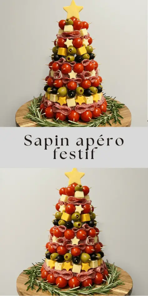 Sapin apéritif composé de tomates cerises, cubes de fromage, olives, saucisson et étoiles décoratives, monté sur un cône et décoré de romarin.