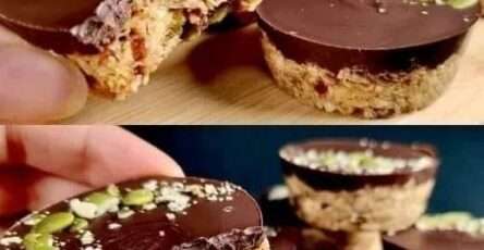 Barres énergétiques maison sans cuisson aux flocons d’avoine, dattes, graines et chocolat noir, découpées en portions régulières sur une surface en bois.